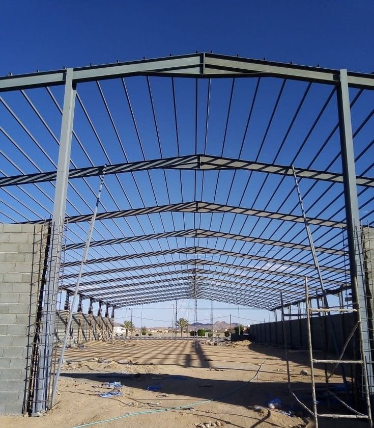 بناء وتصميم هناجر ومستودعات حديد احترافية في الرياض - مؤسسة العثمان تصميم-وبناء-هناجر-ومستودعات-الرياض تنفيذ مشاريع الهناجر والمستودعات بأعلى معايير الجودة والأمان في الرياض. صورة توضح أعمال مؤسسة العثمان في بناء وإنشاء الهناجر والمستودعات الحديدية الصناعية والتجارية في مدينة الرياض بأفضل المواصفات والهياكل المقاومة.

